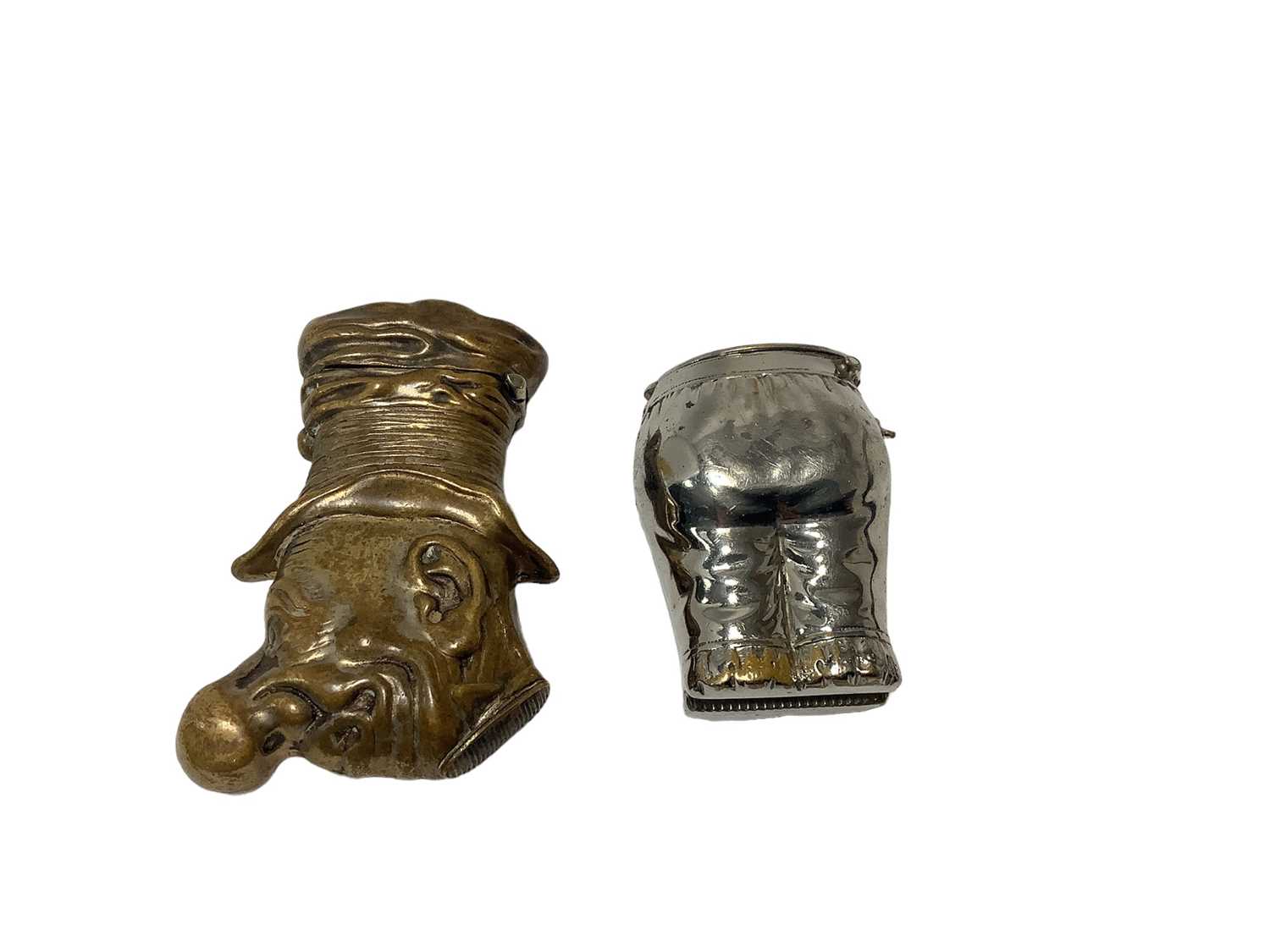 Lot 8 - Victorian brass novelty Vesta case in the form of Ally Sloper (an inebriated man in top hat )60mm and another plated example in the form a pair of knickers 41mm (2)