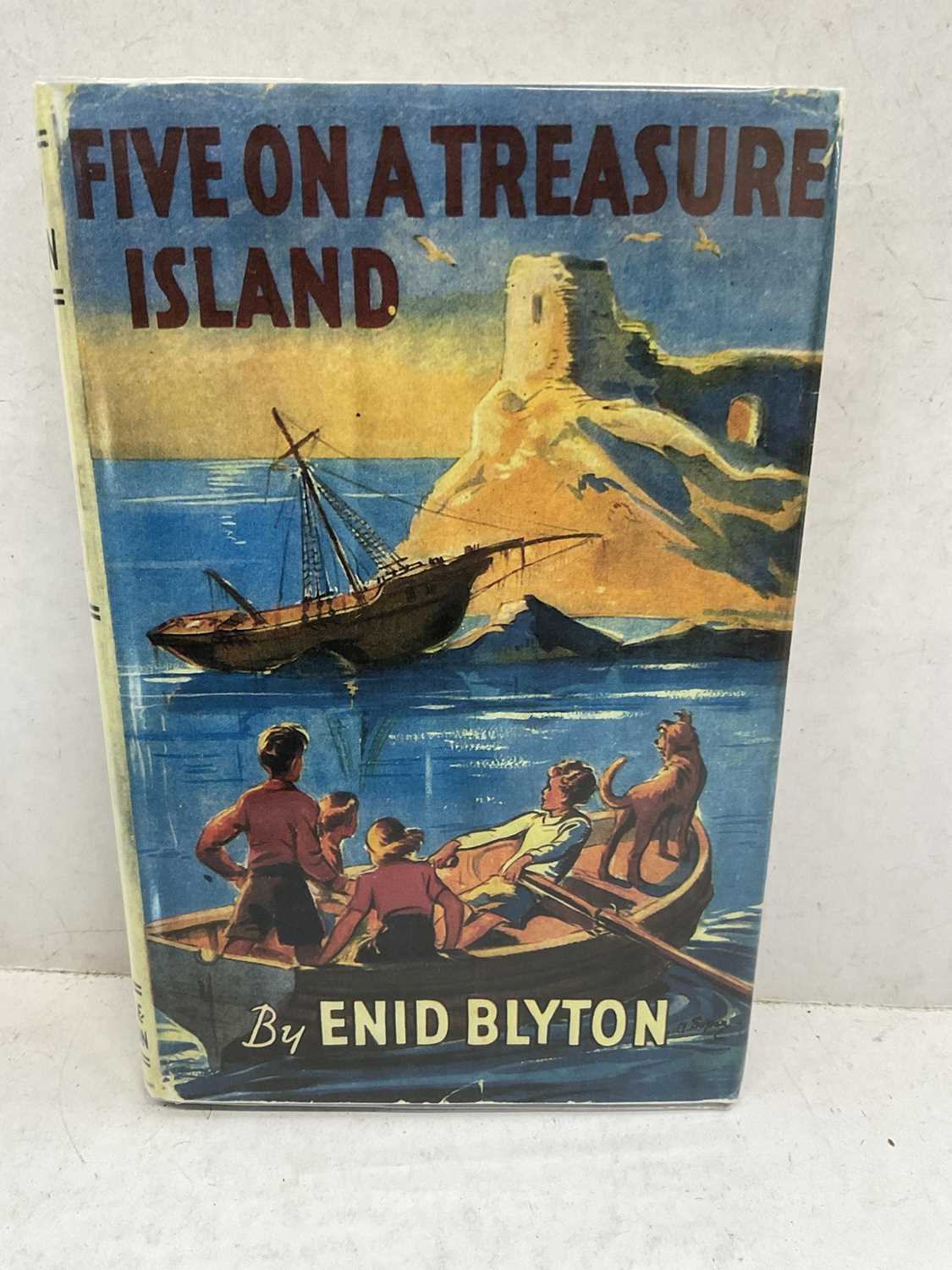 Lot 1594 - Enid Blighton - Five on a Treasure Island, 1942 first edition of the first Famous Five book, facsimile dust jacket