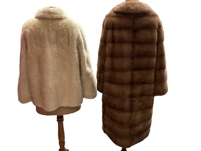 Lot 2122 - Cream mink jacket by Coles of Sheffield, white fur (probably ermine) capelet, 1970s Derry & Toms fitted mink coat and a red squirrel fur coat and mtching hat by Joseph Fox.  Plus a mink hats by De...