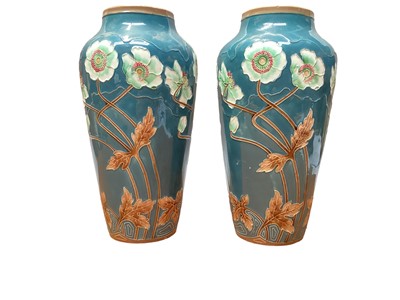 Lot 1220 - Pair of Eichwald Art Nouveau pottery vases with tube lined decoration of poppies