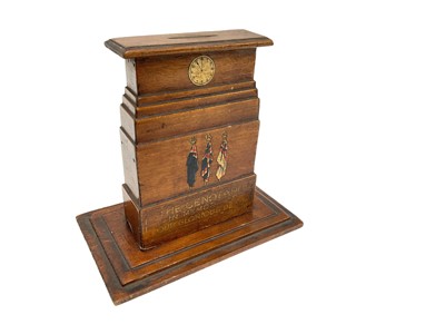 Lot 709 - First World War interest- wooden money box in the form of The Cenotaph, with applied decals and captioned 'The Cenotaph in memory of our glorious dead', 15.5cm in overall height.