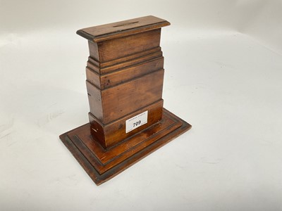 Lot 709 - First World War interest- wooden money box in the form of The Cenotaph, with applied decals and captioned 'The Cenotaph in memory of our glorious dead', 15.5cm in overall height.