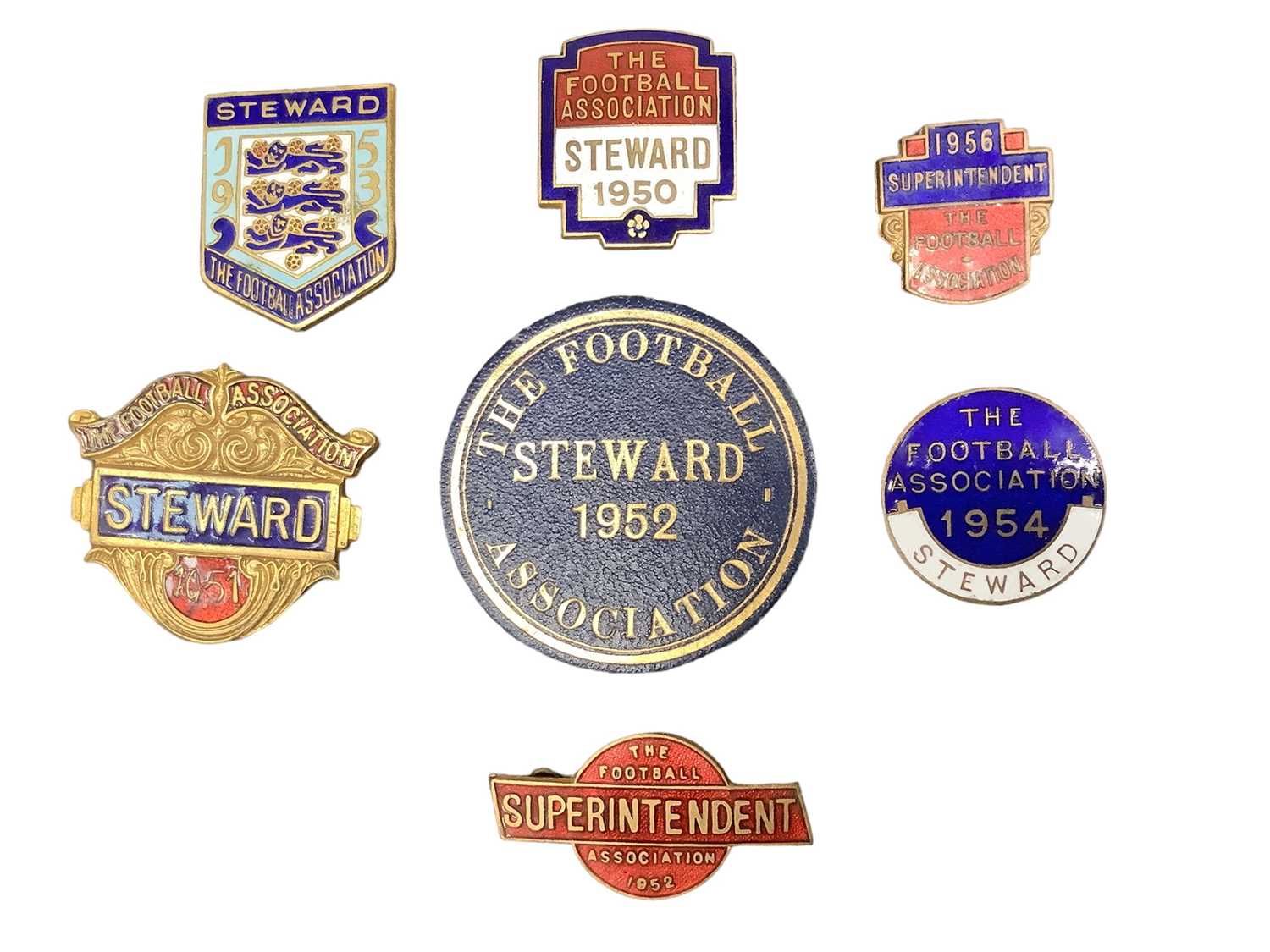 Lot 2524 - Seven 1950s football badges, each dated between 1950 and 1956, including five enamel steward and superintendent badges and one leather steward badge