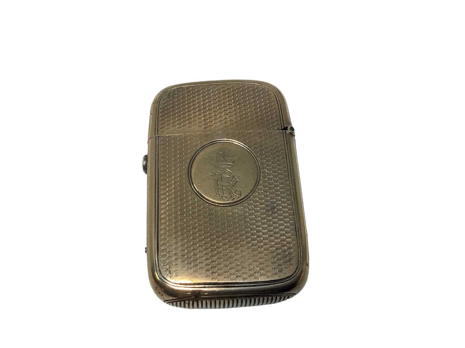 Lot 25 - Victorian silver Vesta case with engraved crest and BR monogram on engine turned ground ( London 1869) 57 x 37mm