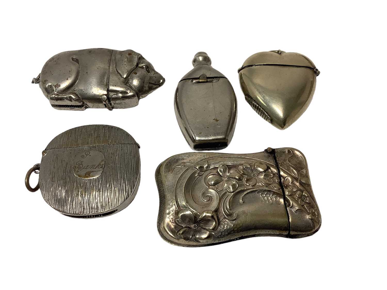 Lot 26 - Five Victorian nickel plated Vesta cases including novelty pig and heart-shaped Vesta (5)