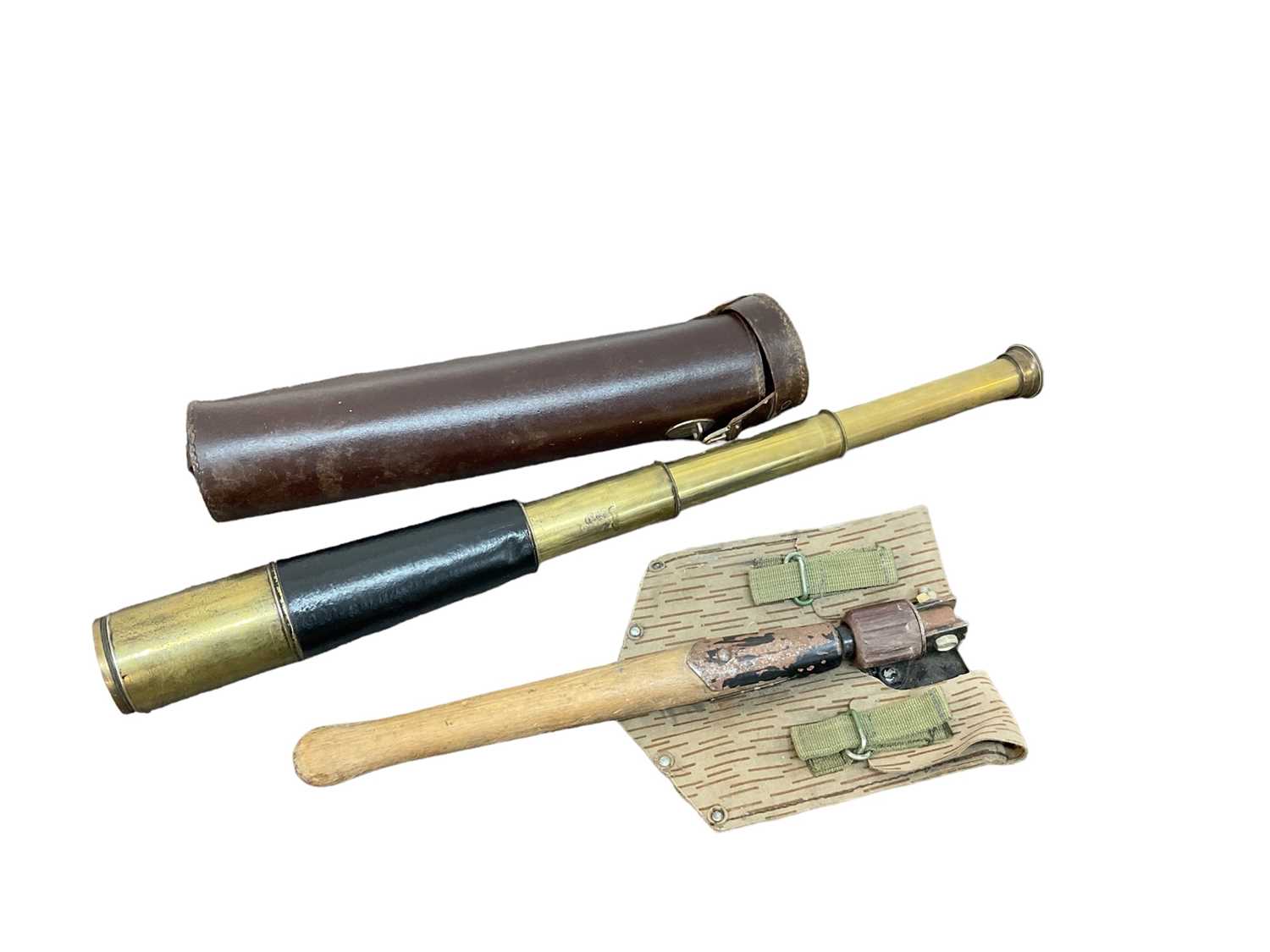 Lot 737 - Leather and brass three draw scope in later leather case, together with a military trenching tool (2)