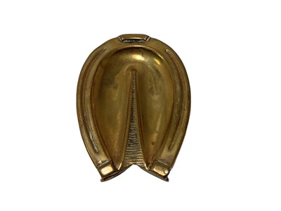 Lot 34 - Three Victorian novelty Vesta cases in the form of horse hooves comprising two brass and a Vulcanite example (3)