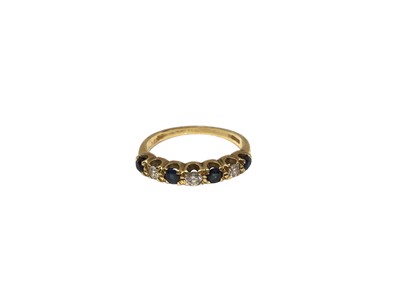 Lot 78 - 18ct gold sapphire and diamond seven stone ring