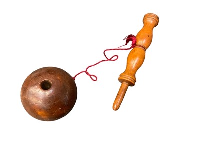 Lot 2560 - Early 19th century Bilboquet or Ball and Catch game with heavy Walnut ball and turned stem and spike.