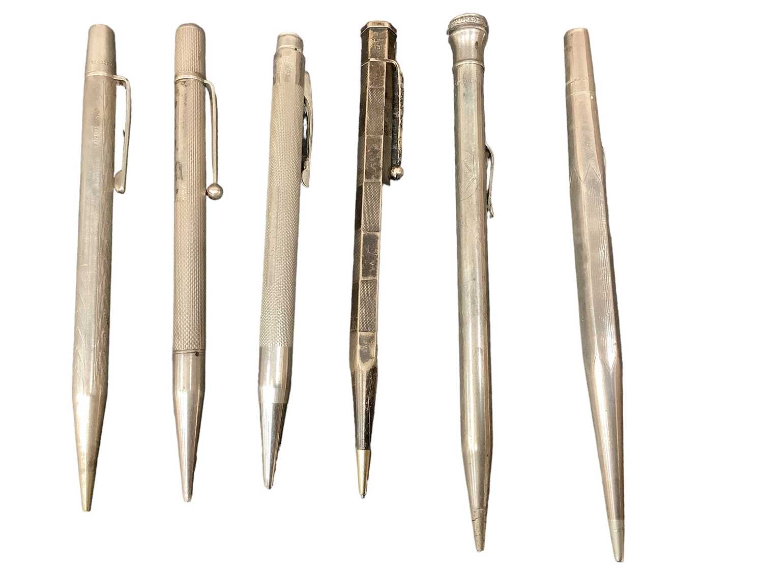 Lot 2504 - Six silver propelling pencils