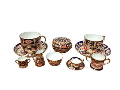 Lot 1246 - Selection of Royal Crown Derby Imari pattern china including two cups and saucers, lidded pot, miniature items etc - 10 pieces, together with a miniature Crown Staffordshire twin handled mug (11)