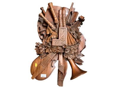 Lot 2537 - After Grinling Gibbons - carved display of instruments and other items relating to music, 70cm high