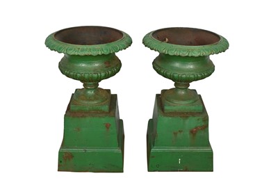 Lot 1294 - Pair of Victorian green painted cast iron urns on stands