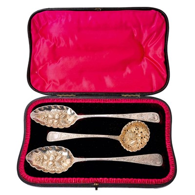 Lot 282 - Pair of Georgian silver berry spoons and sugar sifting spoon in fitted box