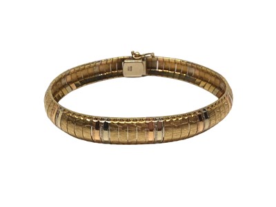 Lot 88 - Three colour gold (stamped 750) articulated link bracelet