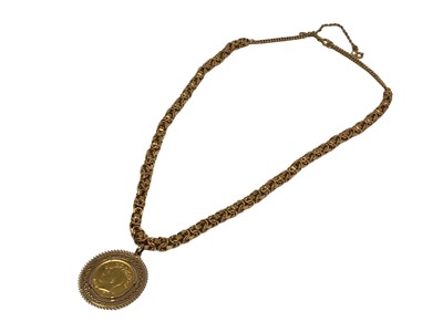 Lot 100 - Iranian gold coin in pendant mount on yellow metal fancy link chain, 49.5cm long