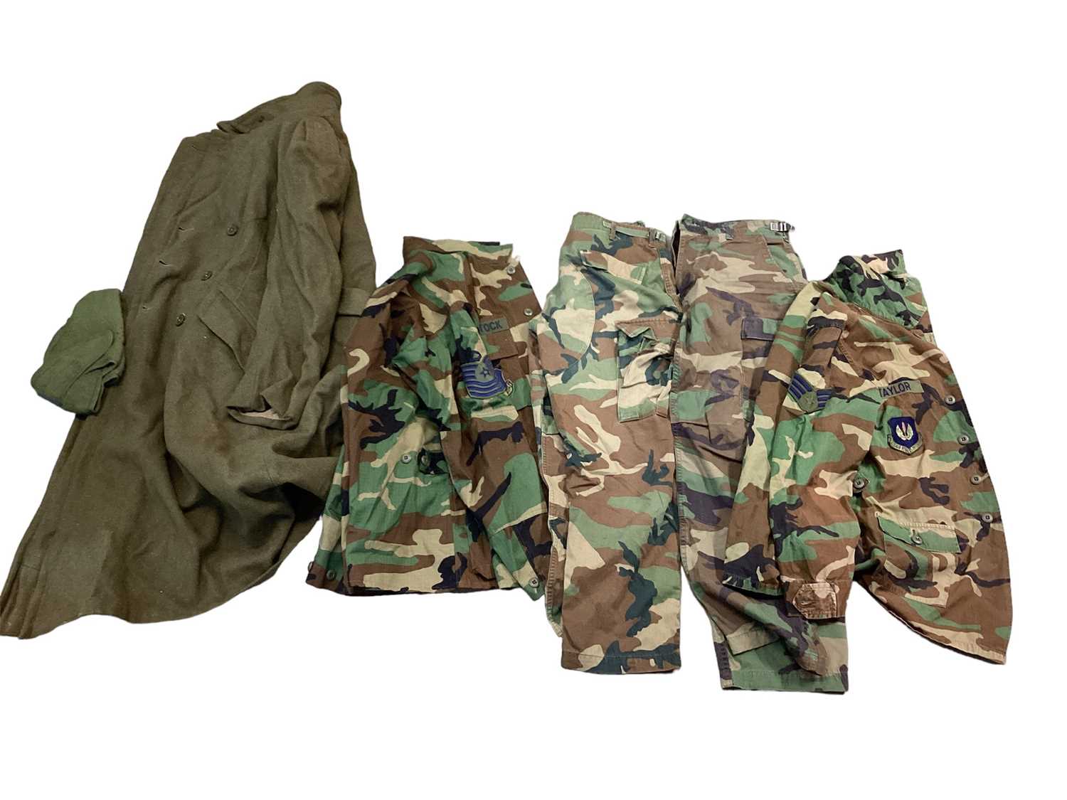 Lot 760 - Collection of mainly American Cold War era camouflage jackets and other uniform, some with patches and insignia (3 boxes)