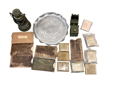 Lot 761 - Collection of Second World War field dressings, military issue lamps, anti gas eye shields and other militaria (one box)