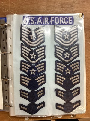 Lot 762 - Three albums of American Air Force military cloth badges to include rank insignia (3 albums)