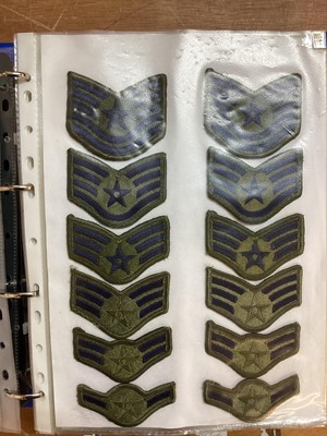 Lot 762 - Three albums of American Air Force military cloth badges to include rank insignia (3 albums)