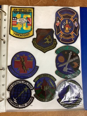 Lot 762 - Three albums of American Air Force military cloth badges to include rank insignia (3 albums)