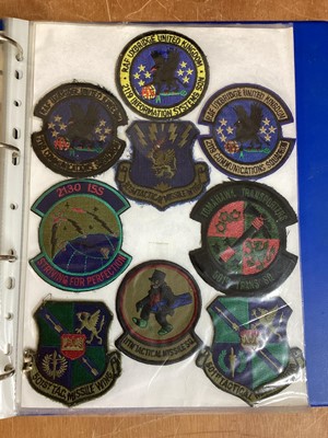 Lot 762 - Three albums of American Air Force military cloth badges to include rank insignia (3 albums)