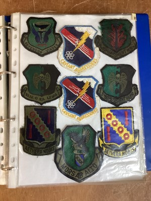 Lot 762 - Three albums of American Air Force military cloth badges to include rank insignia (3 albums)