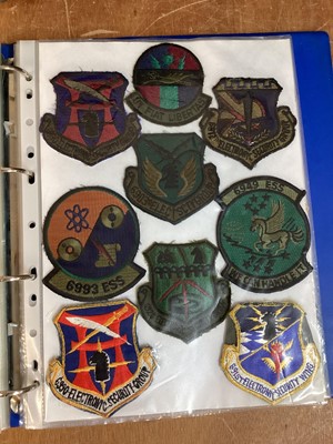 Lot 762 - Three albums of American Air Force military cloth badges to include rank insignia (3 albums)