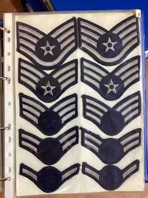 Lot 762 - Three albums of American Air Force military cloth badges to include rank insignia (3 albums)