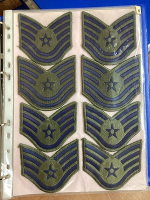 Lot 762 - Three albums of American Air Force military cloth badges to include rank insignia (3 albums)