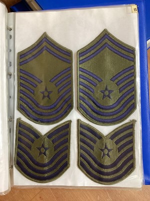 Lot 762 - Three albums of American Air Force military cloth badges to include rank insignia (3 albums)