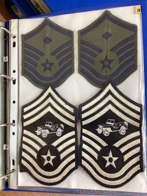 Lot 762 - Three albums of American Air Force military cloth badges to include rank insignia (3 albums)