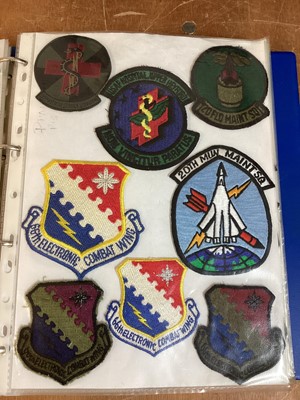 Lot 762 - Three albums of American Air Force military cloth badges to include rank insignia (3 albums)