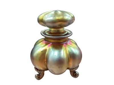 Lot 1258 - Good quality iridescent scent bottle of lobed form, on three scroll feet, indistinctly signed and numbered