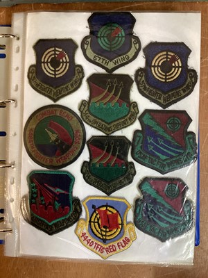 Lot 764 - Three albums of American Air Force military cloth badges to include rank insignia (3 albums)