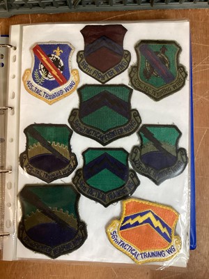 Lot 764 - Three albums of American Air Force military cloth badges to include rank insignia (3 albums)