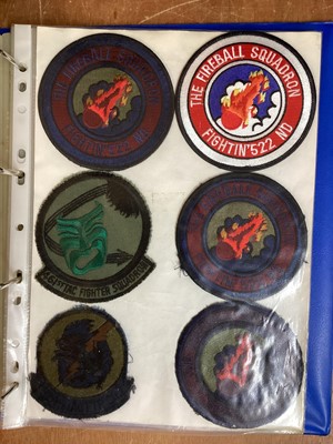 Lot 764 - Three albums of American Air Force military cloth badges to include rank insignia (3 albums)