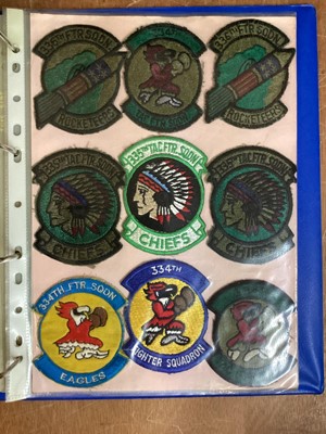 Lot 764 - Three albums of American Air Force military cloth badges to include rank insignia (3 albums)