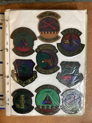 Lot 764 - Three albums of American Air Force military cloth badges to include rank insignia (3 albums)