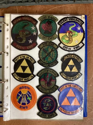 Lot 764 - Three albums of American Air Force military cloth badges to include rank insignia (3 albums)