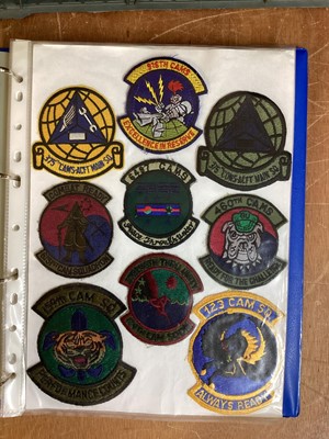 Lot 764 - Three albums of American Air Force military cloth badges to include rank insignia (3 albums)