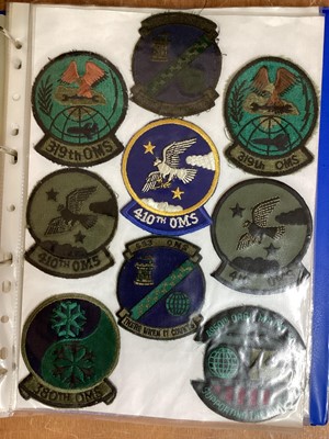 Lot 764 - Three albums of American Air Force military cloth badges to include rank insignia (3 albums)