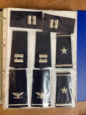 Lot 764 - Three albums of American Air Force military cloth badges to include rank insignia (3 albums)