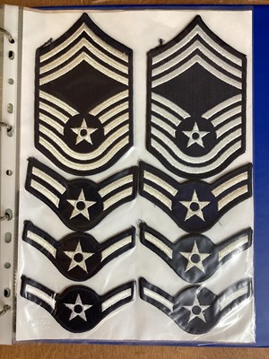 Lot 764 - Three albums of American Air Force military cloth badges to include rank insignia (3 albums)