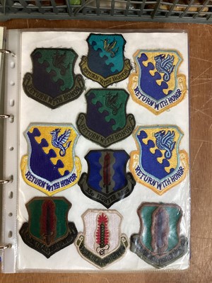 Lot 764 - Three albums of American Air Force military cloth badges to include rank insignia (3 albums)