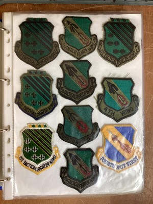 Lot 764 - Three albums of American Air Force military cloth badges to include rank insignia (3 albums)