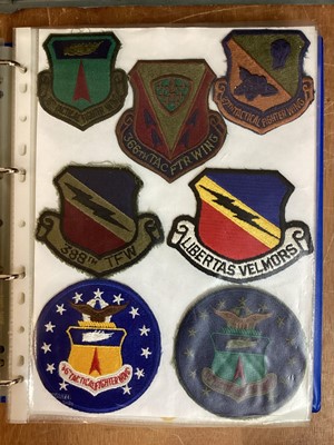 Lot 764 - Three albums of American Air Force military cloth badges to include rank insignia (3 albums)