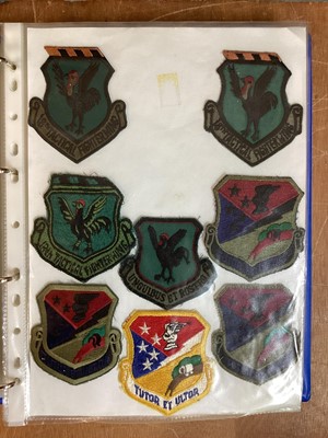 Lot 764 - Three albums of American Air Force military cloth badges to include rank insignia (3 albums)