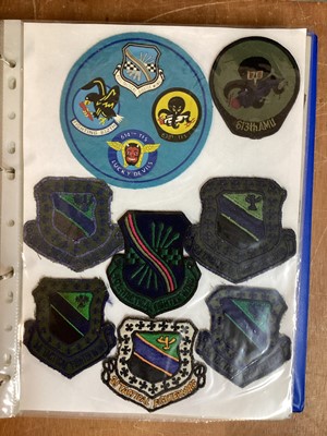 Lot 764 - Three albums of American Air Force military cloth badges to include rank insignia (3 albums)