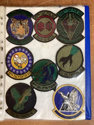 Lot 764 - Three albums of American Air Force military cloth badges to include rank insignia (3 albums)